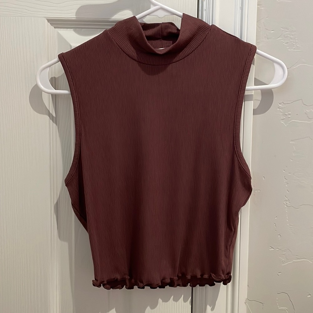 Brown, ribbed tank top with a turtle neck. Never worn, no rips holes.